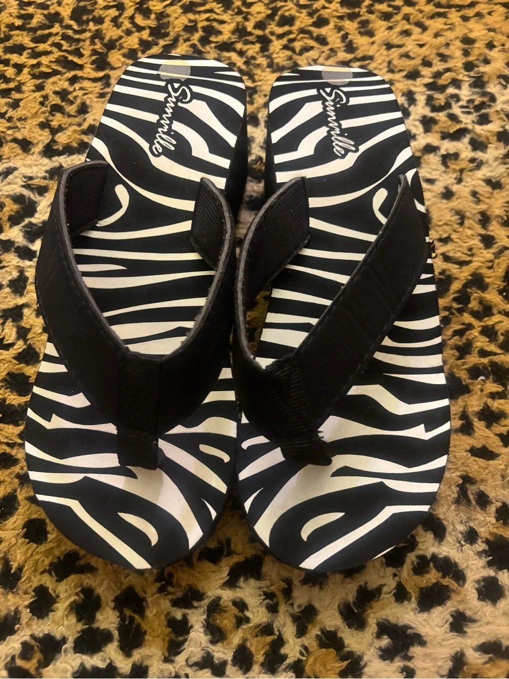 women’s size 6 zebra flip flops/wedges